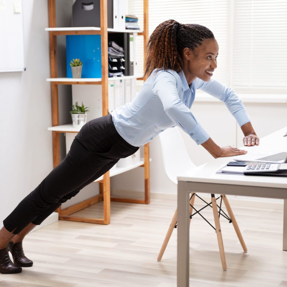 Side,View,Of,A,Happy,Young,Businesswoman,Doing,Push,Up